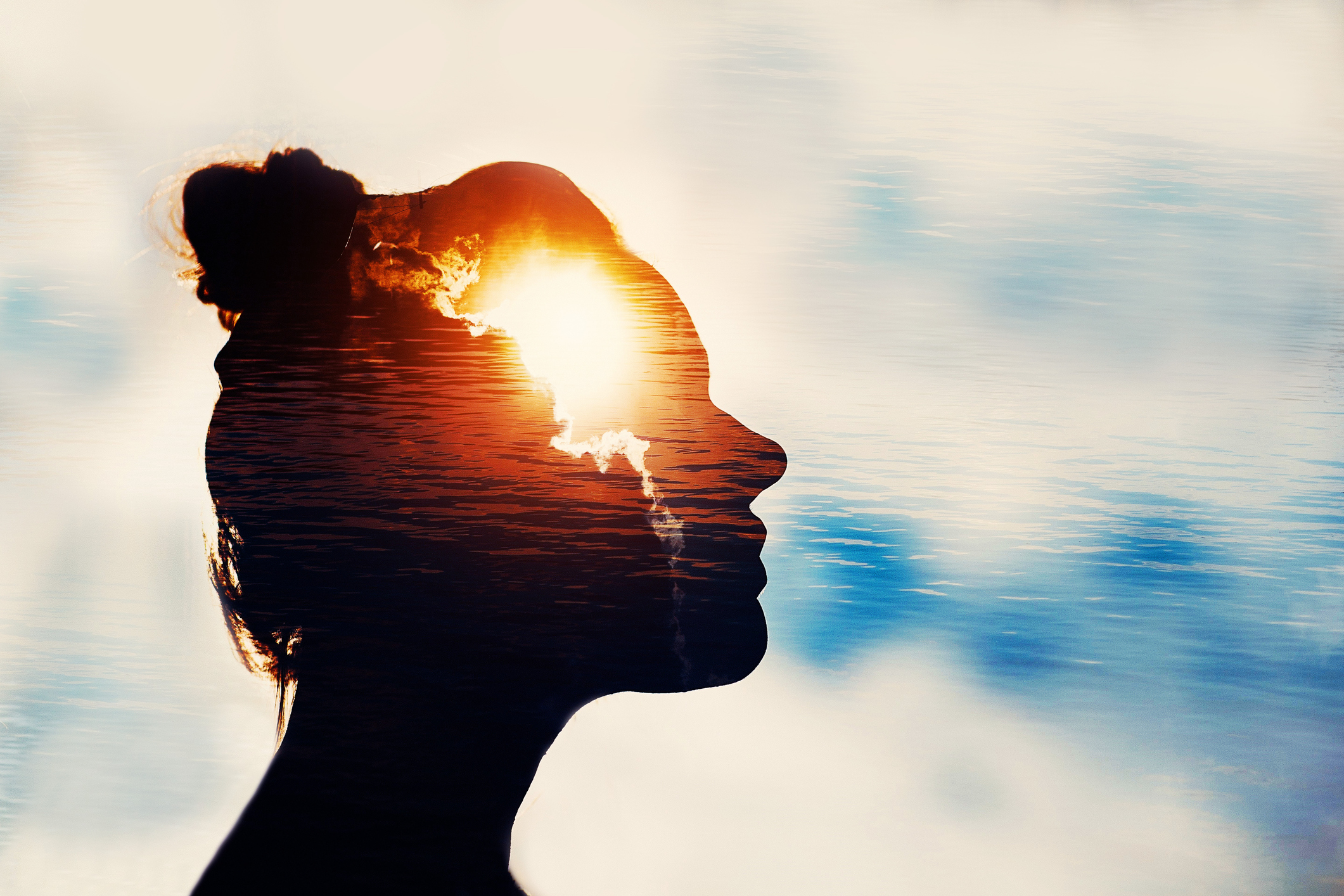 Light shining on the silhouette of a female head