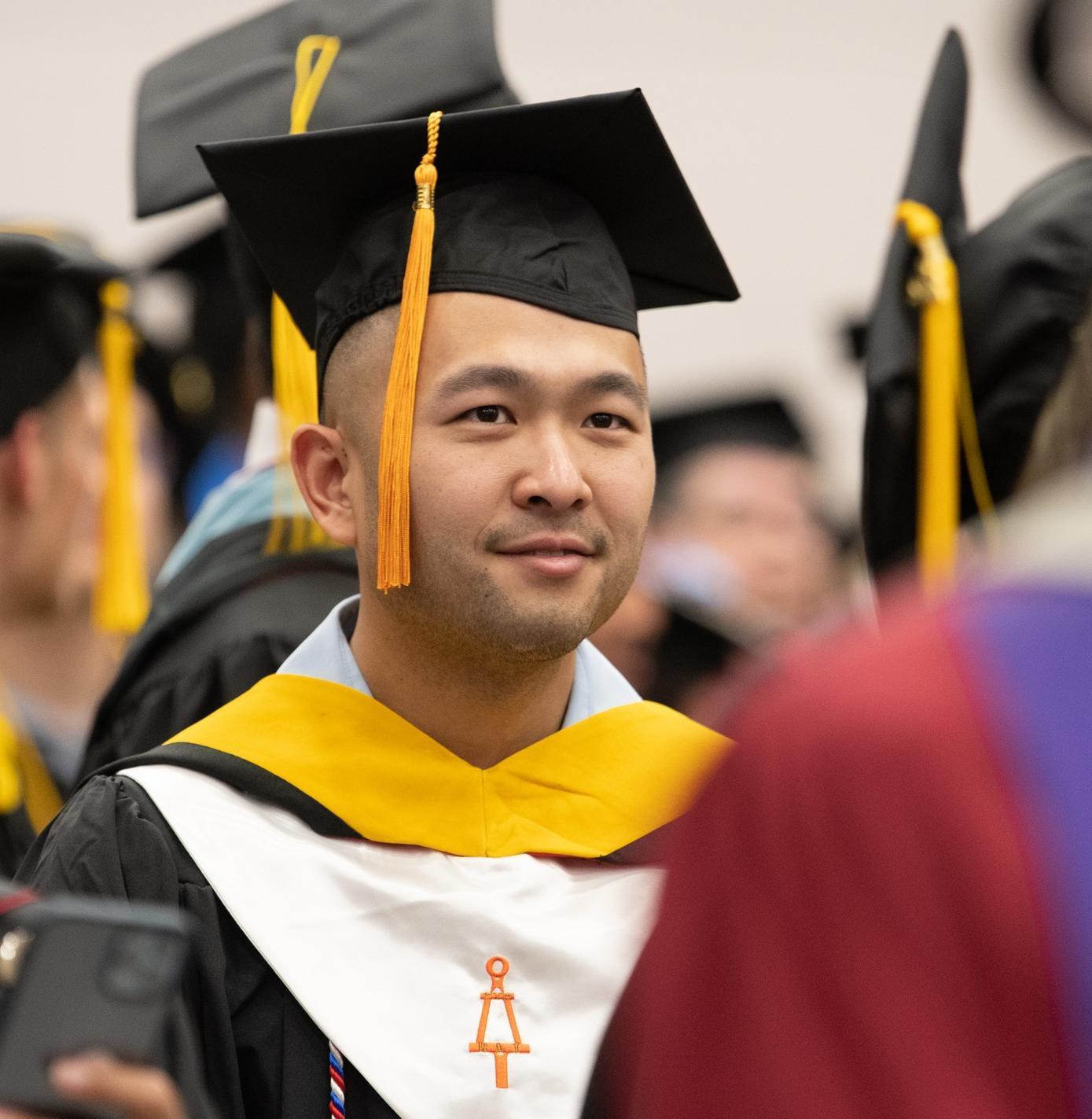An engineering graduate and member of Tau Beta Pi engineering honor society at commencement