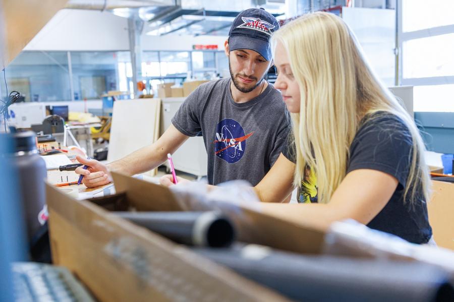 Aerospace engineering students collaborate on a project