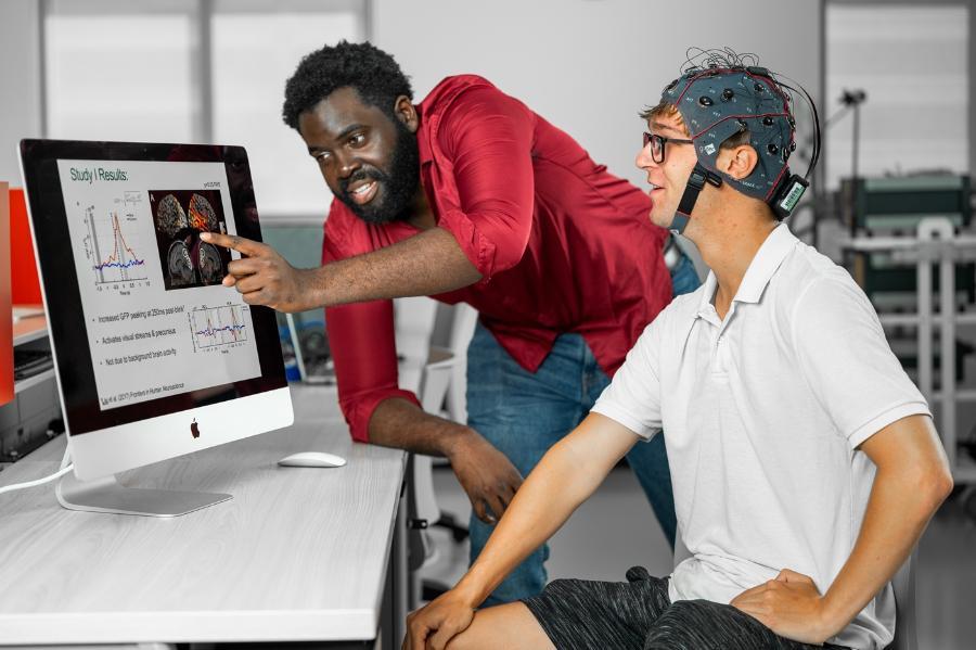 Students reviewing the results of a brain scan study