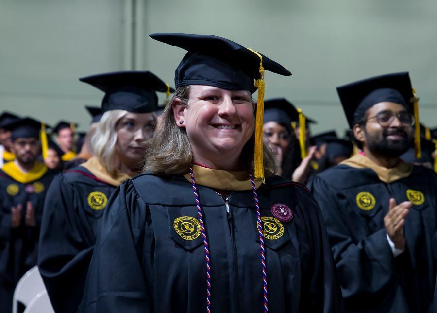A student graduating with her master's degree
