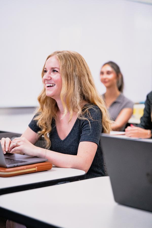 Students in a classroom taking notes