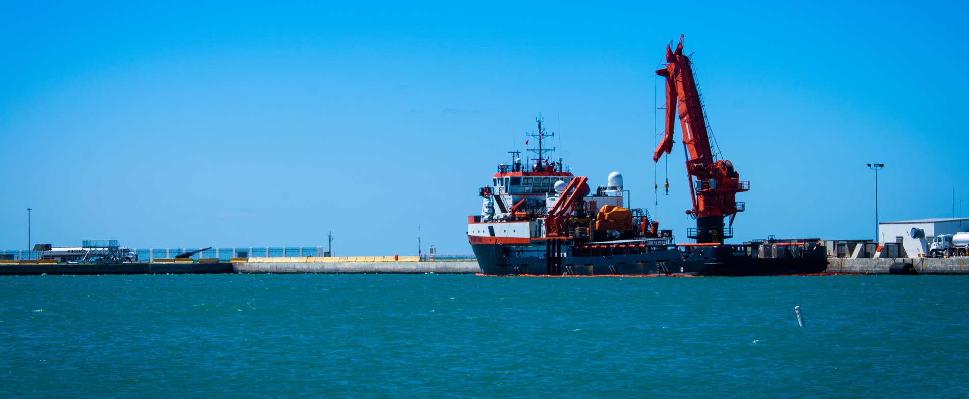 A ship and a crane at a dock