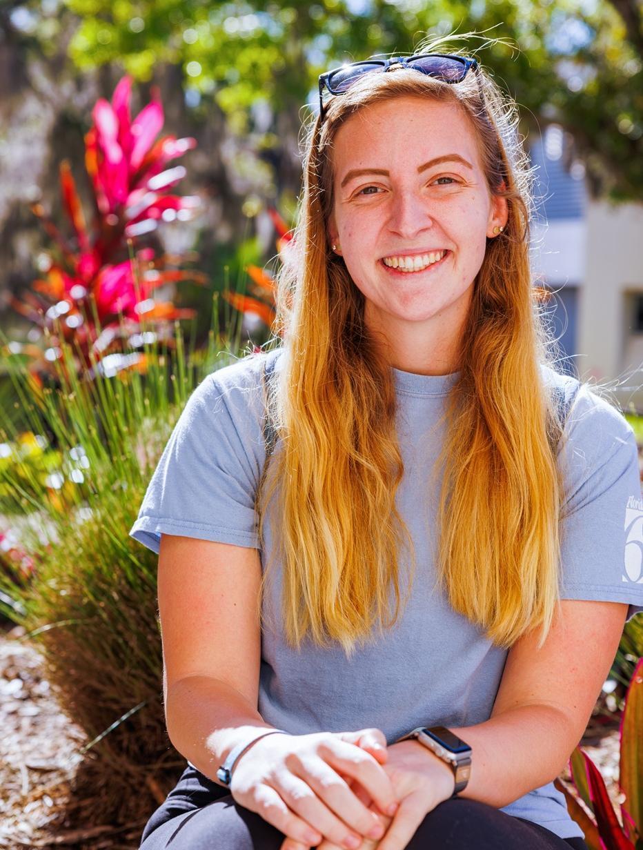 A student enjoying the sunshine on campus.