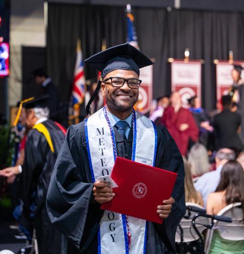 A meteorology graduate at commencement