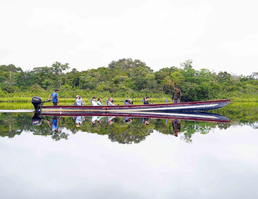 Professor Mark Bush, center of boat, leads Florida Tech students in a summer field course on the Lagartococha River in the Ecuadorean Amazon. Photo credit: Rich Aronson
