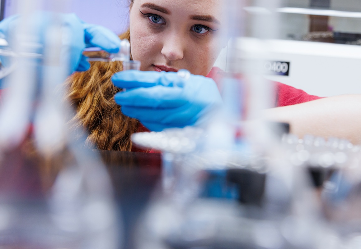 A student conducting an experiment in a lab