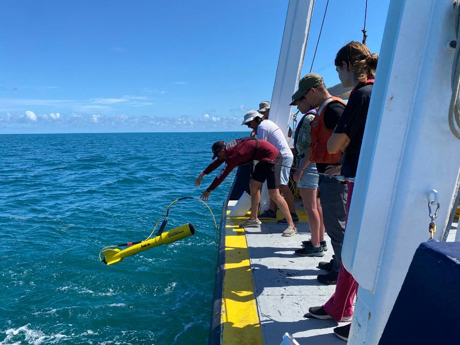 Students launching an ROV on a research cruise