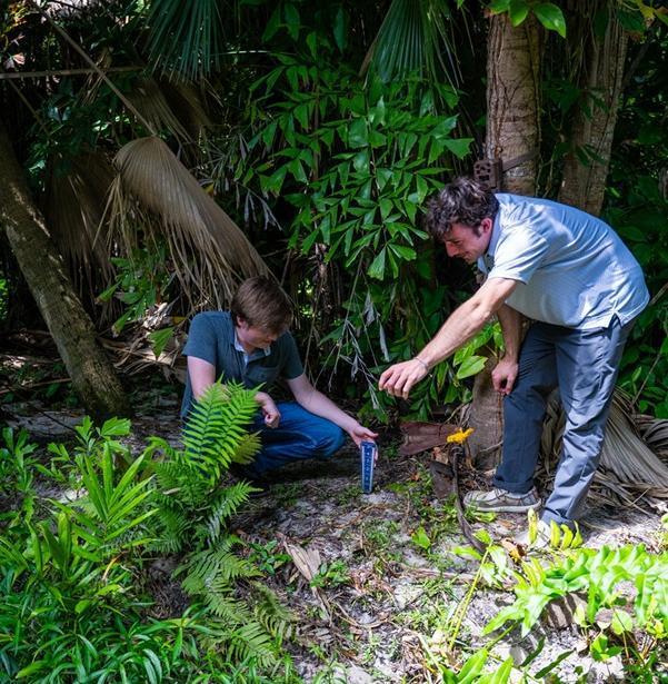 Students installing sensors and cameras to gather data on storm water debris and erosion