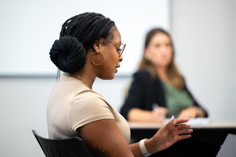 A student participates in a class discussion.