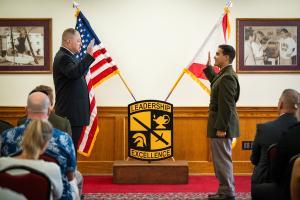 Florida Tech ROTC student salutes as he is officially commissioned.