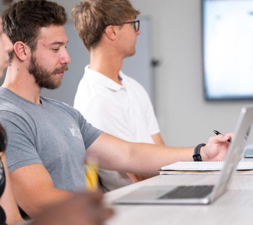Students having a meeting in a research lab