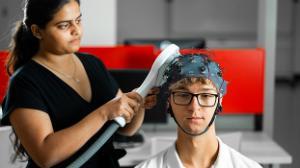 Biomed students using brain scanning equipment
