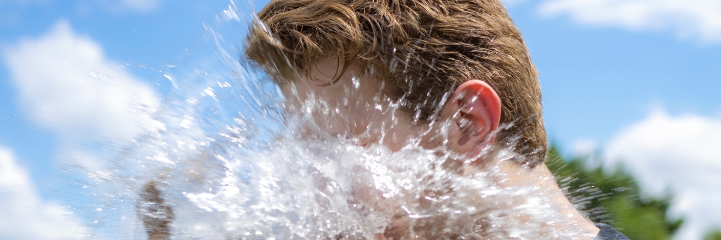 Student bursts water balloon in his face.