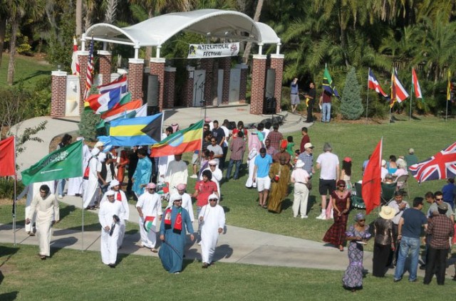 Students holding flags respresenting their country