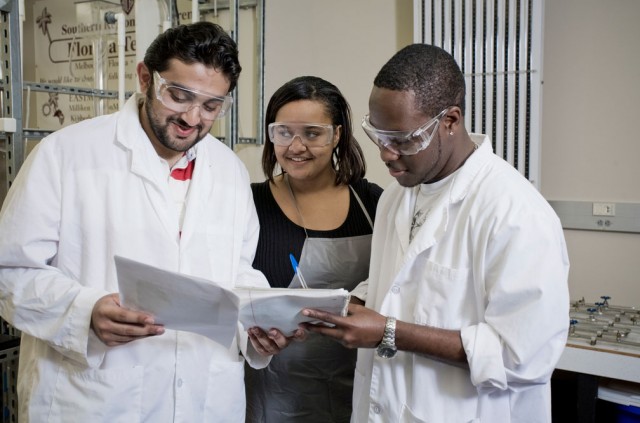 Three students in a chemistry lab
