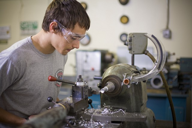 A student working with steel