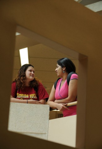 Two students talking inside