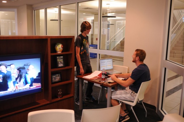 Two students talking in the lobby