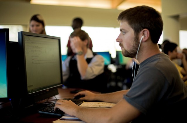 A student working in a computer lap