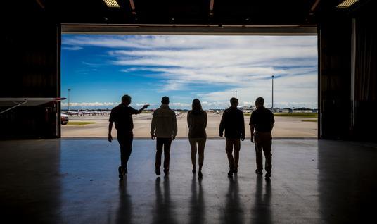 pilots walking from hangar