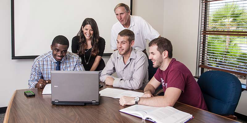 Students sitting around table