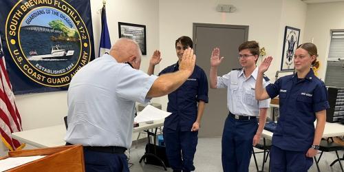 Second year AUP students are sworn in as Flotilla Staff Officers. Photo Credit: W. Cox, USCGAUX