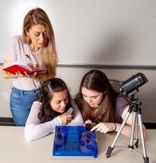 Students conduct an experiment in the Roach Lab.