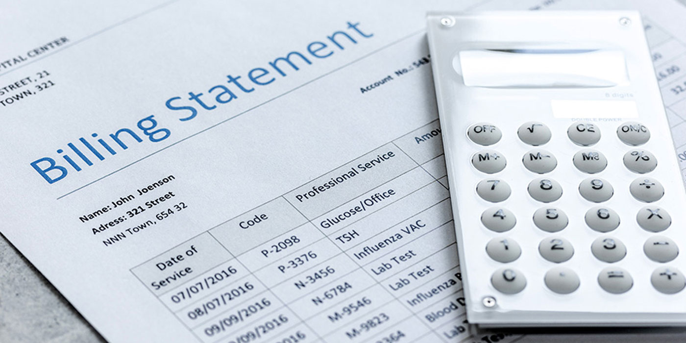 medical billing statement and a calculator
