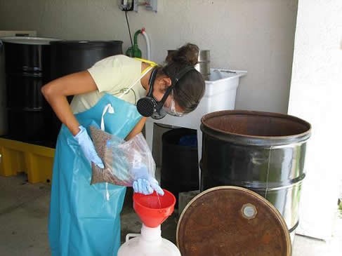 student with face mask combining chemicals