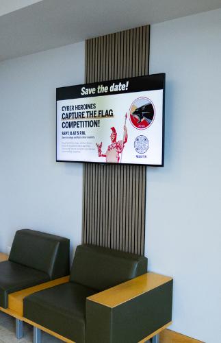 Image of a digital screen in L3Harris Commons lobby