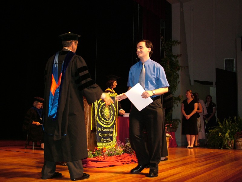 Shaking hands after receiving his certificate