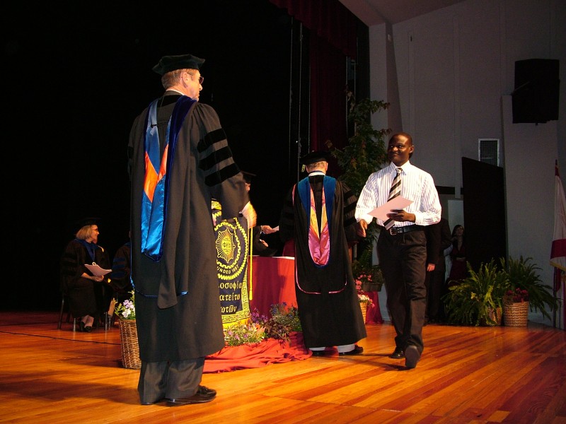Walking across the stage after receiving his certificate