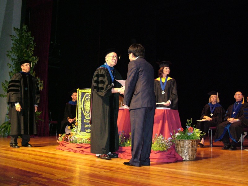 A student receiving their certificate