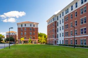 Exterior of Florida Tech's L3Harris Village buildings, which are five stories tall with brick facades.