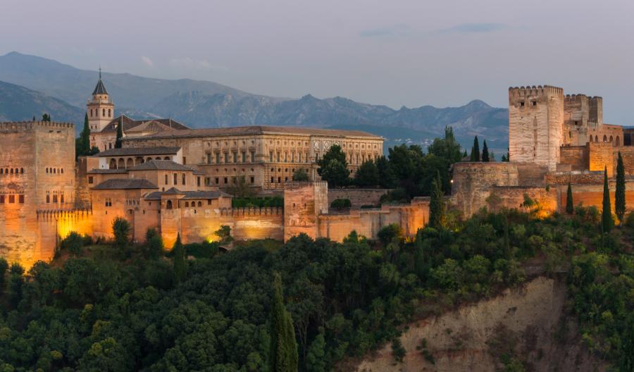 Lights shining on Alhambra, a fortress complex